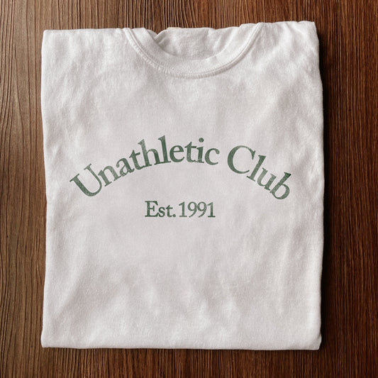 White shirt with green lettering that says Unathletic Club Established 1991